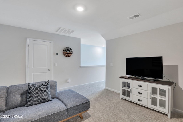 living room featuring light carpet