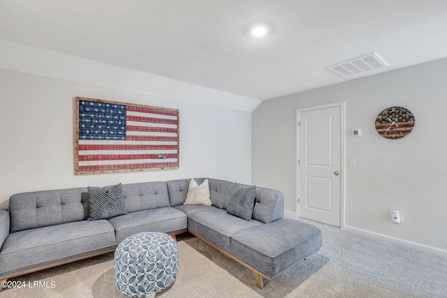 living room featuring vaulted ceiling and carpet flooring