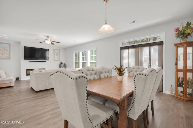 346 Sawmill Rd, Hardeeville, SC 29927 - dining space featuring a ceiling fan, light wood-style flooring, baseboards, and visible vents