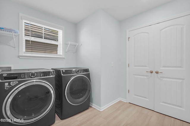 346 Sawmill Rd, Hardeeville, SC 29927 - laundry room featuring washing machine and clothes dryer, baseboards, wood finished floors, and laundry area