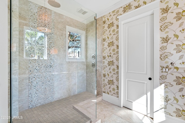 full bathroom featuring tile patterned flooring, walk in shower, visible vents, and wallpapered walls