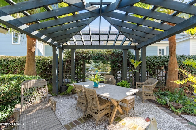 view of patio featuring outdoor dining area and a pergola