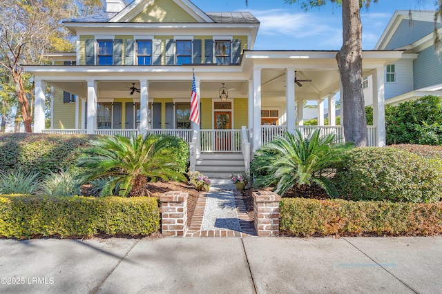 view of front of home featuring a balcony, covered porch, and ceiling fan