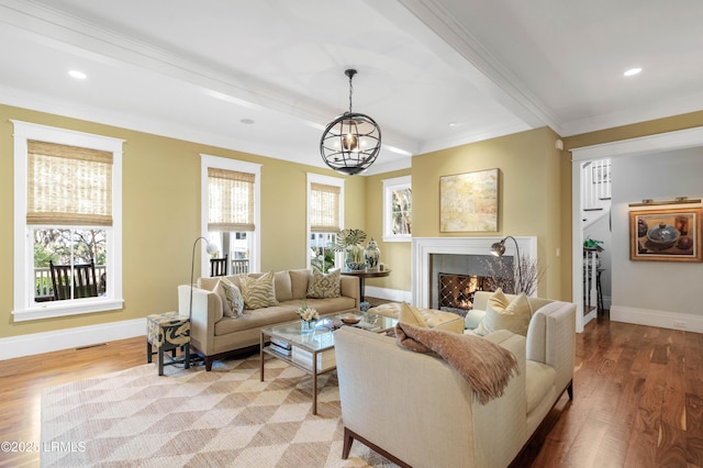 living room with light wood-type flooring, a high end fireplace, and baseboards