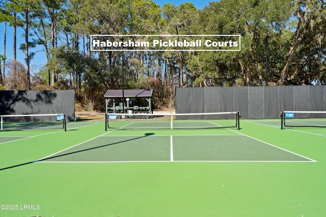 view of sport court with community basketball court and fence