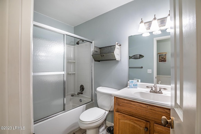 full bathroom with vanity, shower / bath combination with glass door, and toilet