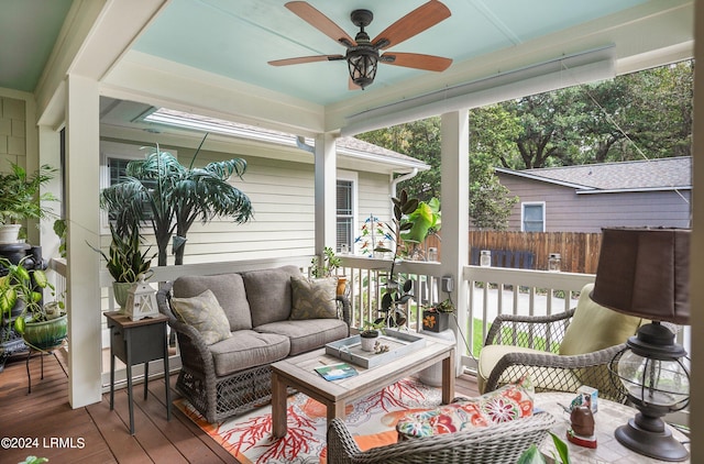 sunroom / solarium with ceiling fan