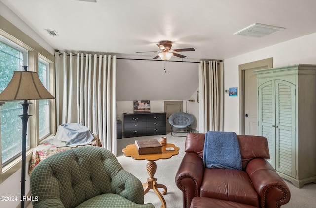 carpeted living room featuring ceiling fan