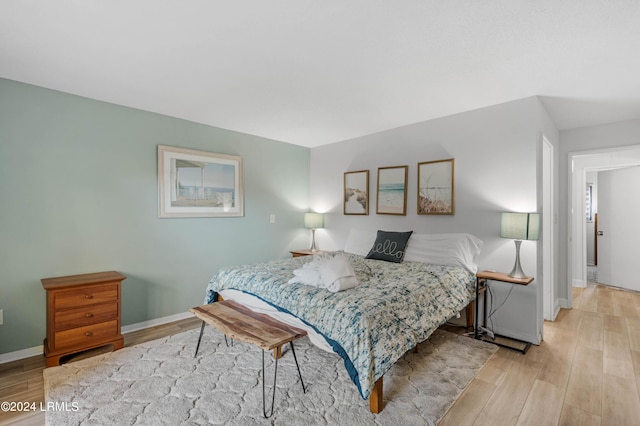 bedroom with light wood-type flooring