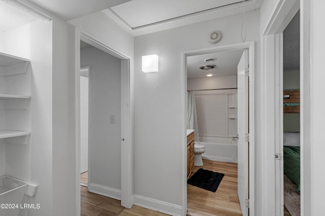 full bathroom featuring vanity, shower / bath combination with curtain, and toilet