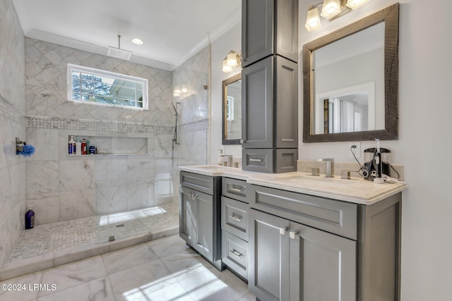 bathroom with tiled shower, ornamental molding, and vanity