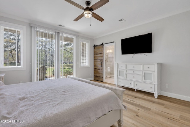 bedroom with ensuite bath, light hardwood / wood-style flooring, access to outside, ceiling fan, and a barn door