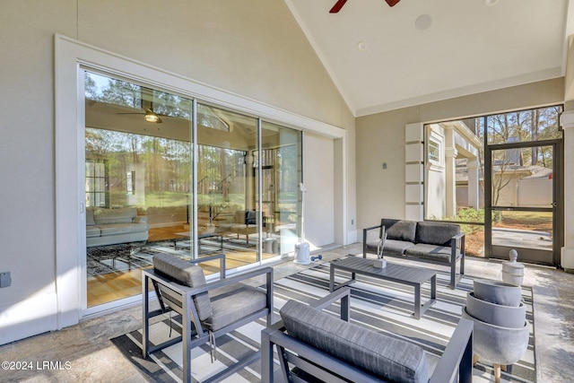 sunroom / solarium featuring vaulted ceiling and ceiling fan