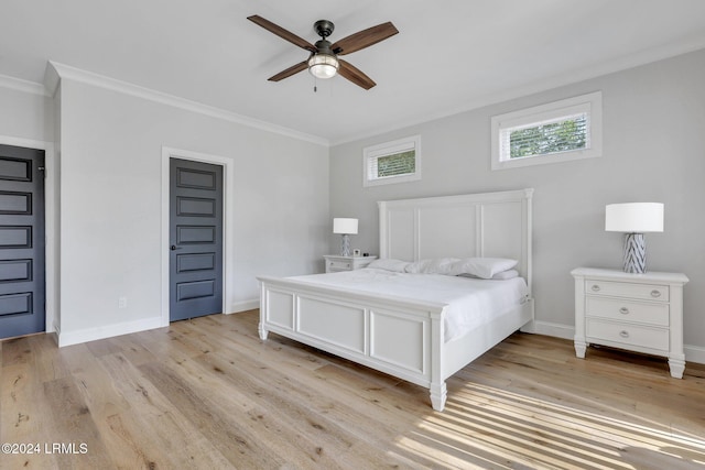 bedroom featuring ceiling fan, ornamental molding, and light wood-type flooring