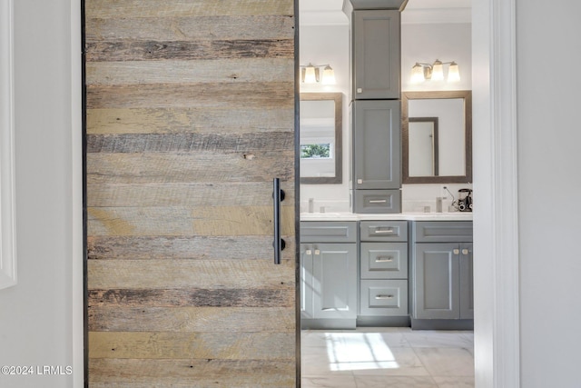 bathroom featuring vanity and ornamental molding