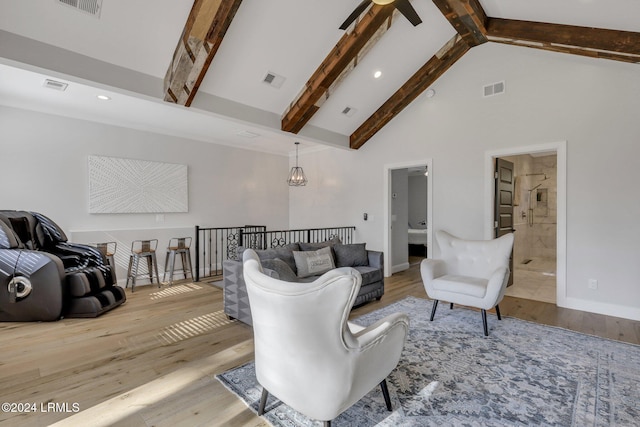 living room featuring ceiling fan with notable chandelier, beam ceiling, high vaulted ceiling, and light wood-type flooring