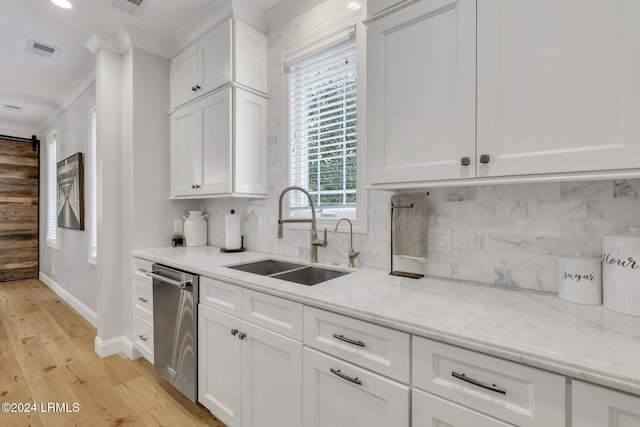 kitchen featuring sink, backsplash, ornamental molding, and white cabinets