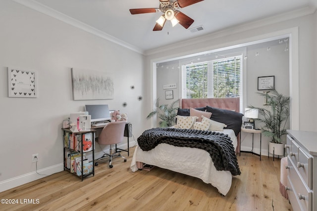 bedroom with crown molding, ceiling fan, and light hardwood / wood-style floors