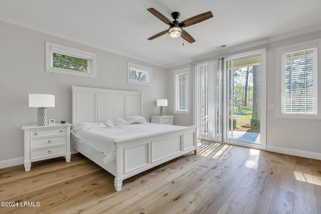 bedroom featuring access to exterior, light hardwood / wood-style flooring, and ceiling fan