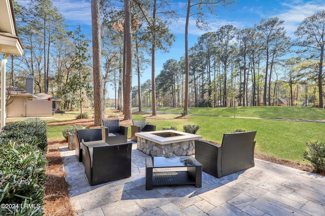 view of patio / terrace with an outdoor fire pit