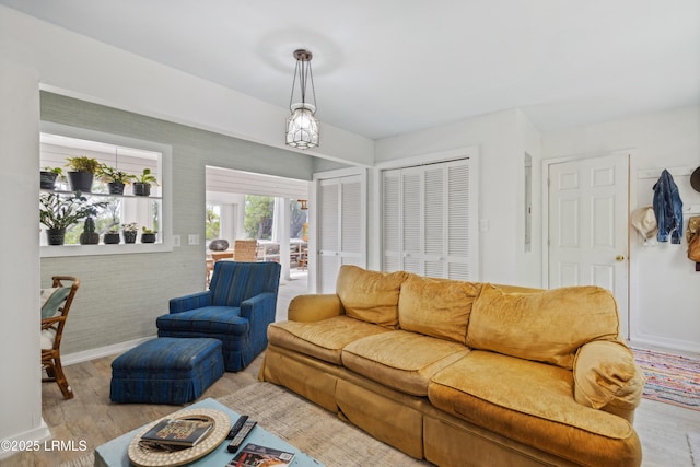 living room with baseboards and wood finished floors