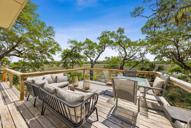 wooden deck with outdoor dining area and outdoor lounge area
