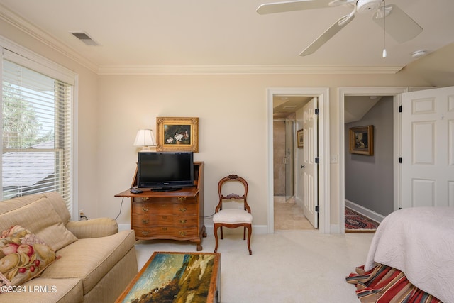 carpeted bedroom featuring crown molding and ceiling fan