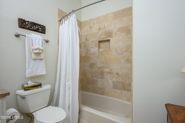 bathroom with shower / tub combo and toilet