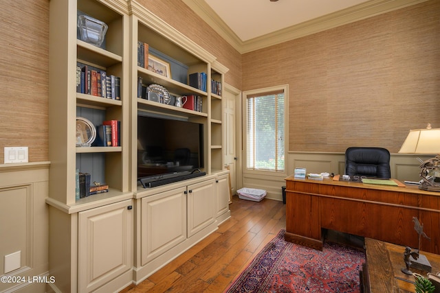 office space featuring crown molding, dark wood-type flooring, and built in shelves