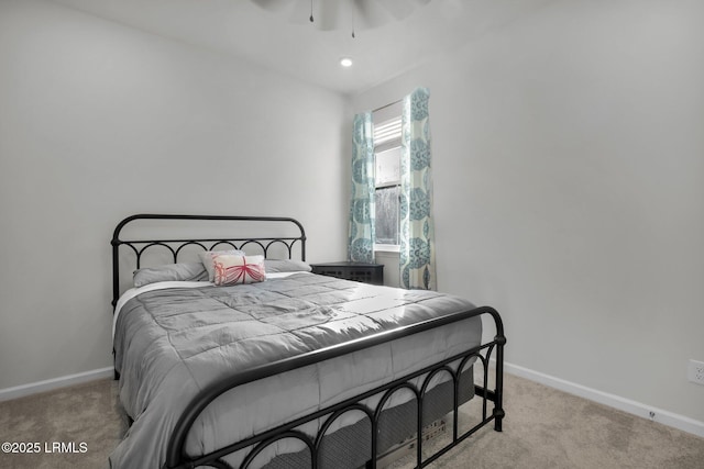 bedroom featuring ceiling fan and light colored carpet