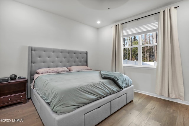 bedroom with light hardwood / wood-style floors