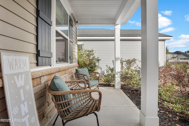 view of patio featuring a porch