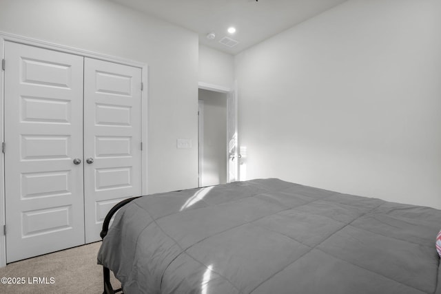 carpeted bedroom with a closet