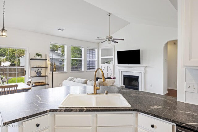 1470 Ashley Gardens Blvd, Charleston, SC 29414 - kitchen featuring a sink, open floor plan, ceiling fan, dark countertops, and lofted ceiling