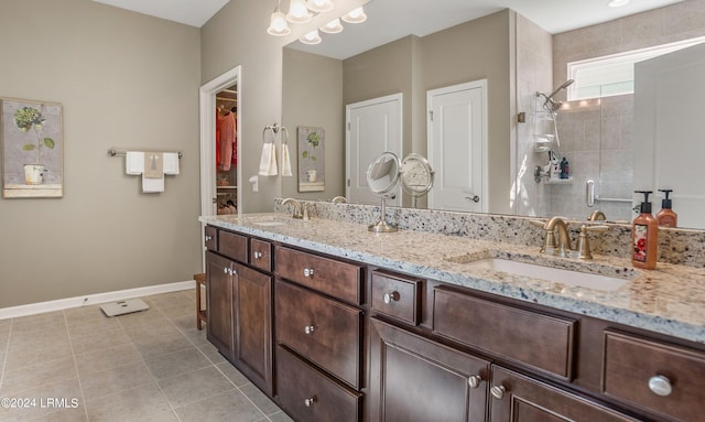 bathroom with vanity, an enclosed shower, and tile patterned floors