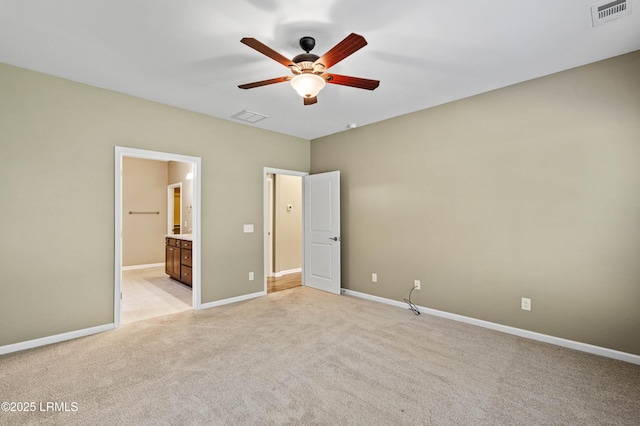 59 Gatewood Ln, Bluffton, SC 29910 - unfurnished bedroom with light colored carpet, ensuite bath, and a ceiling fan