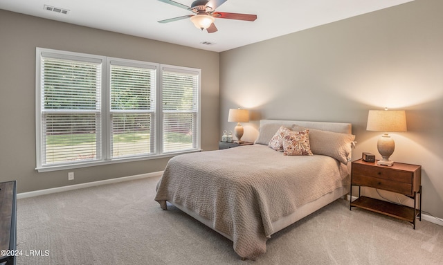 bedroom with light carpet and ceiling fan