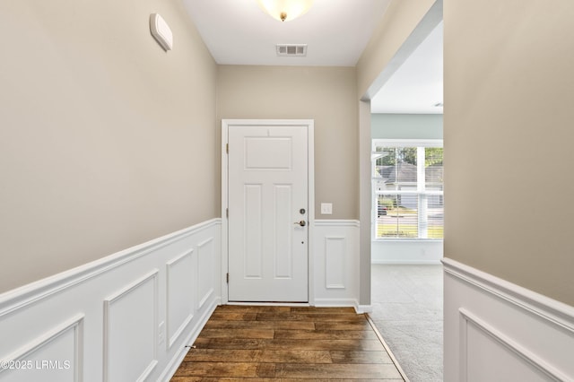 59 Gatewood Ln, Bluffton, SC 29910 - entryway featuring a wainscoted wall and wood finished floors