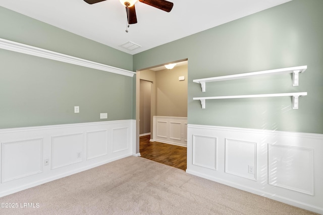 59 Gatewood Ln, Bluffton, SC 29910 - carpeted spare room featuring ceiling fan, a wainscoted wall, and a decorative wall