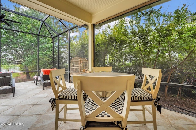 view of patio featuring a lanai