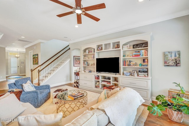 living room with ceiling fan, ornamental molding, light hardwood / wood-style flooring, and built in features