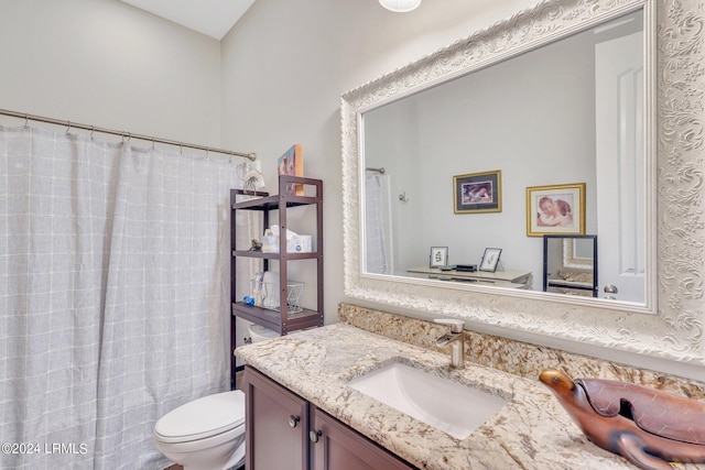 bathroom with a shower with curtain, vanity, and toilet