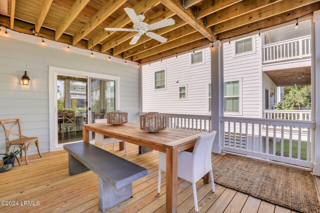 wooden deck featuring ceiling fan