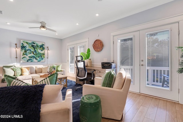 living room with ceiling fan, light wood-type flooring, and french doors