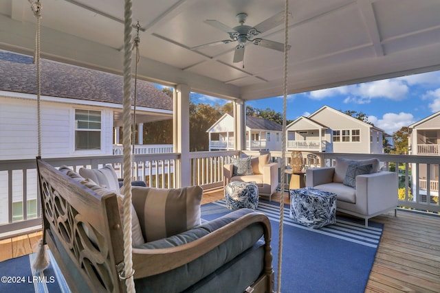 wooden deck featuring an outdoor hangout area and ceiling fan