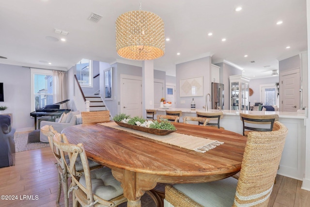 dining room with a chandelier and sink