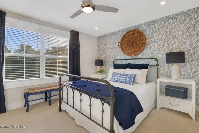 carpeted bedroom featuring ceiling fan