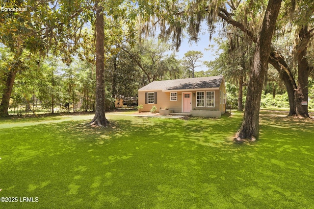 1809 Battery Park Dr, Port Royal, SC 29935 - view of front of house with a front yard and roof with shingles