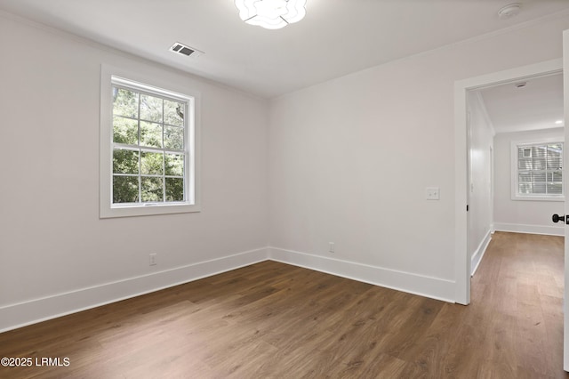 1809 Battery Park Dr, Port Royal, SC 29935 - empty room with baseboards, dark wood-style floors, ornamental molding, and a smoke detector