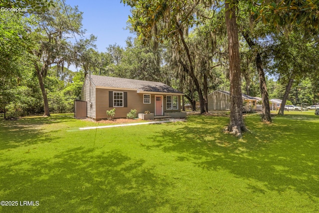 1809 Battery Park Dr, Port Royal, SC 29935 - view of front facade featuring central AC unit and a front yard